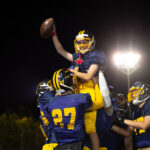 football team celebration at night under bright li 2026 03 25 22 56 18 utc
